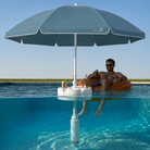 Swimbrella floating pool umbrella providing shade while relaxing in a swimming pool